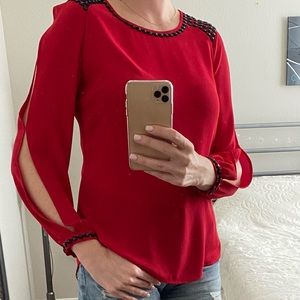Elegant red blouse.